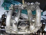 Mercedes M102 Intake Manifold With Parts. Fixed Price $470.00.
